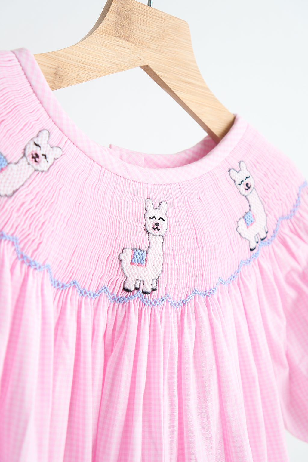 Pink alpaca hand smocked gingham dress